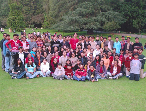 A Group of students with their teachers on a school tour
		 conducted by Sunil Tours